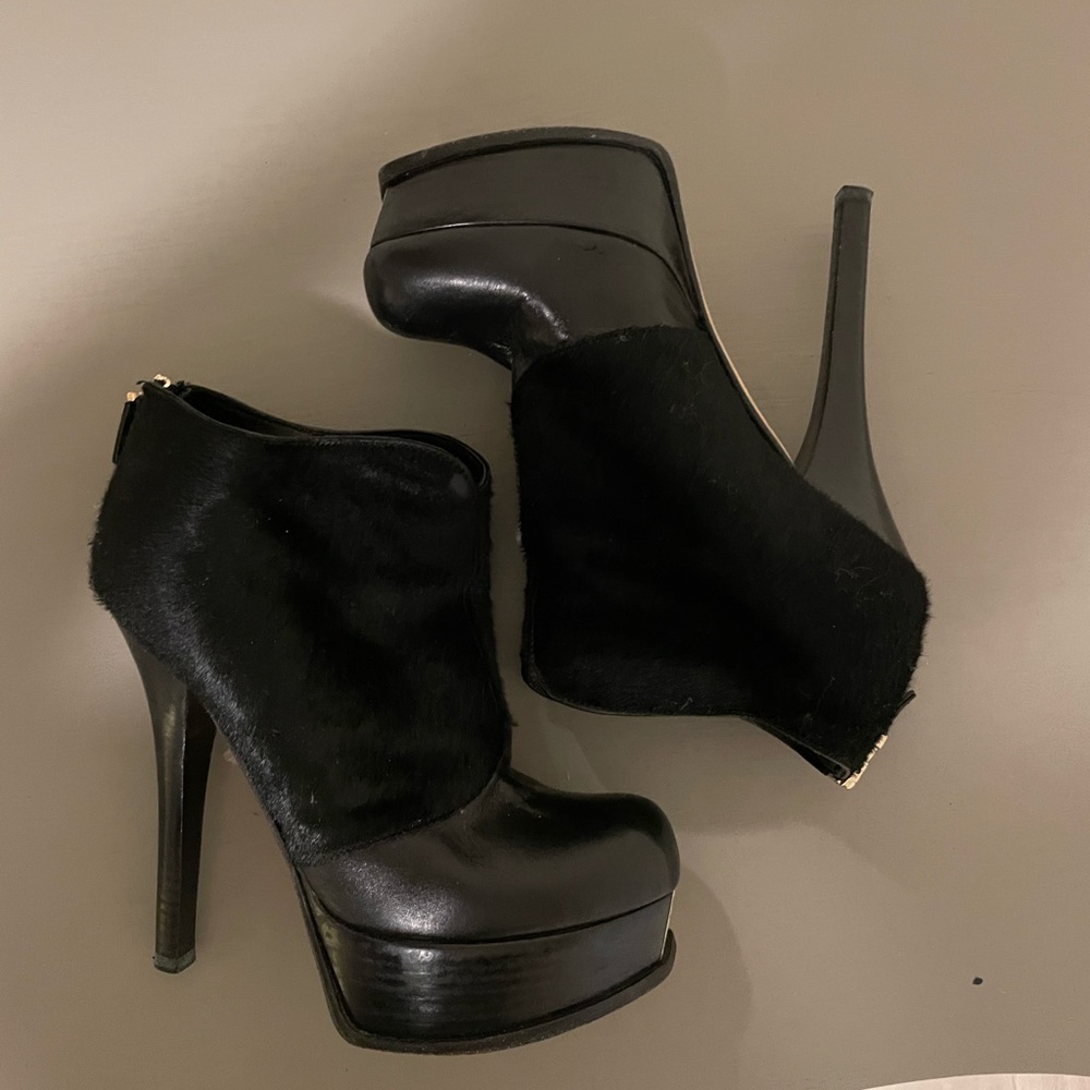 FENDI leather ankle boots with fur and gold toe accent.